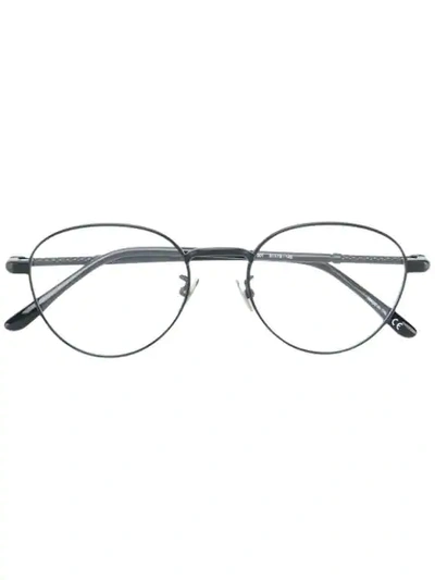 Shop Bottega Veneta Round Frame Glasses In Black