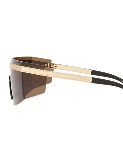 Shop Versace Logo Band Visor Sunglasses In Gold