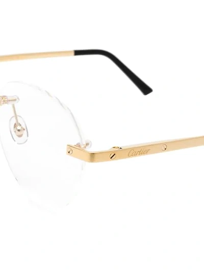 Shop Cartier No Frame Round Glasses In Black