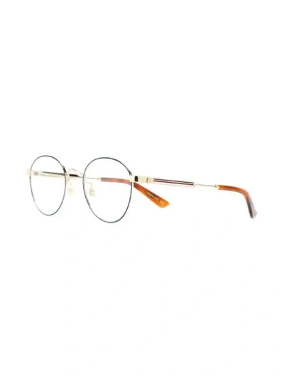 Shop Gucci Round Glasses In Metallic