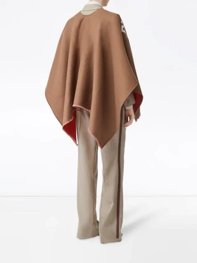 Shop Burberry Logo Detail Wool Jacquard Cape In Brown