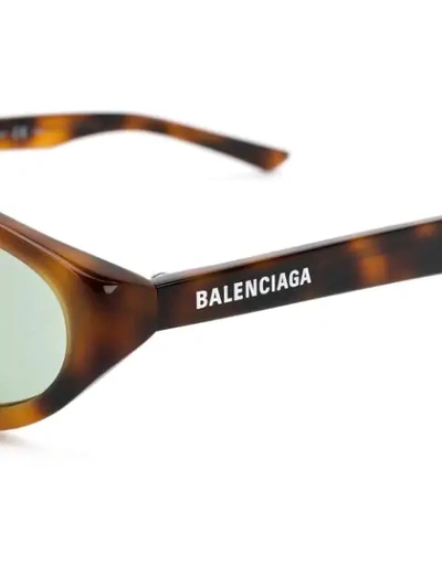 Shop Balenciaga Narrow Oval-frame Sunglasses In Brown