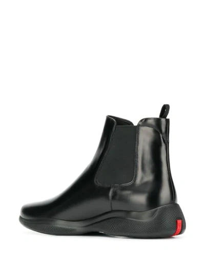 Shop Prada Space Chelsea Boots In Black