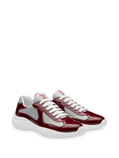 Shop Prada High-shine Low-top Sneakers - Red