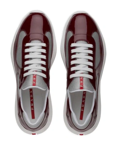 Shop Prada High-shine Low-top Sneakers - Red