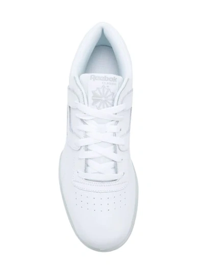 Shop Reebok Workout Clean Ripple Sneakers In White