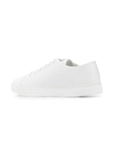 Shop Emporio Armani Embossed Logo Sneakers In White