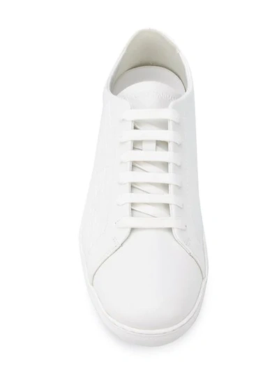 Shop Emporio Armani Embossed Logo Sneakers In White