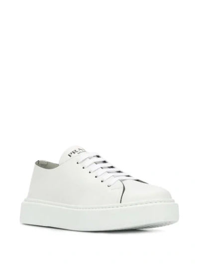 Shop Prada Flat Sole Sneakers - White