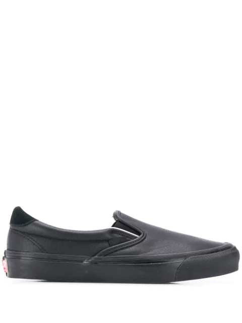 vans black sole slip on