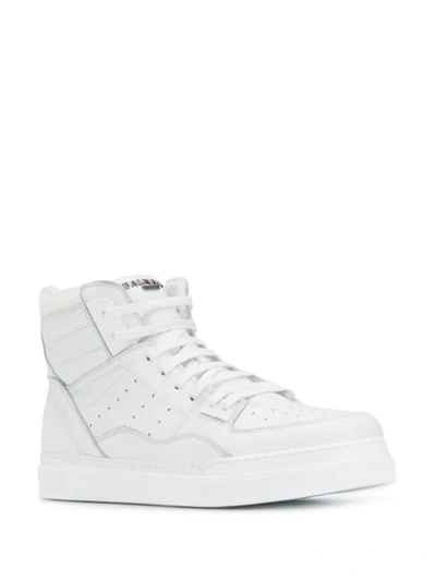 Shop Balmain Kyle Hi-top Sneakers In White