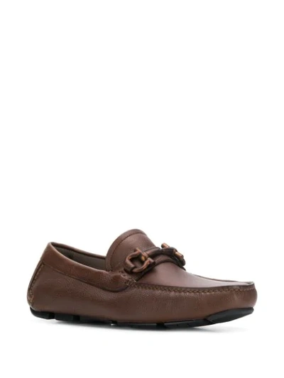 Shop Ferragamo Gancini Buckle Loafers In Brown