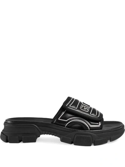 Shop Gucci Embossed Logo Chunky Sliders  In Black