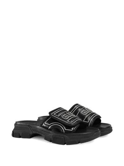 Shop Gucci Embossed Logo Chunky Sliders  In Black