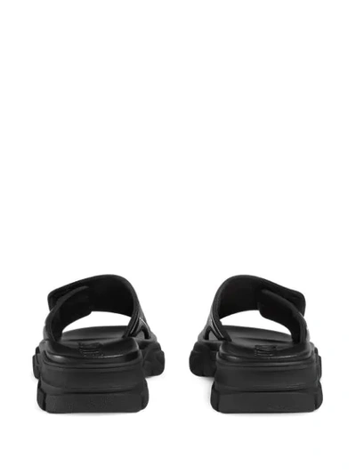 Shop Gucci Embossed Logo Chunky Sliders  In Black