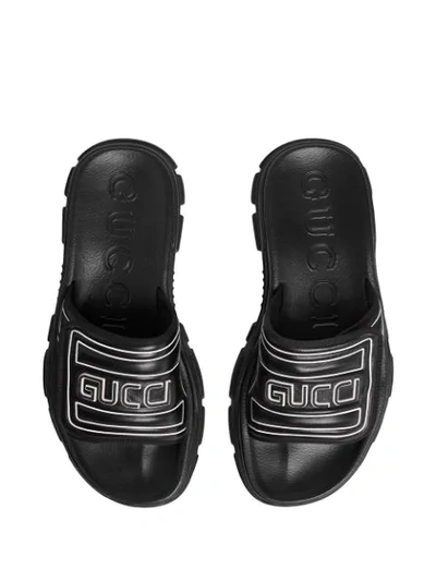 Shop Gucci Embossed Logo Chunky Sliders  In Black