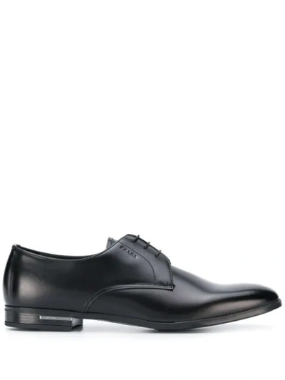 Shop Prada Logo-embossed Derby Shoes In Black