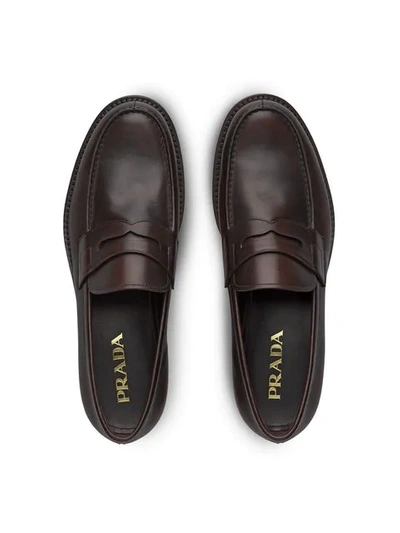 Shop Prada Leather Loafers In Brown