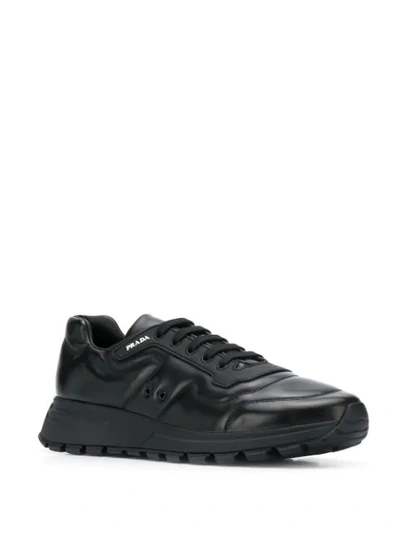 Shop Prada Low Lace-up Sneakers In F0002 Black