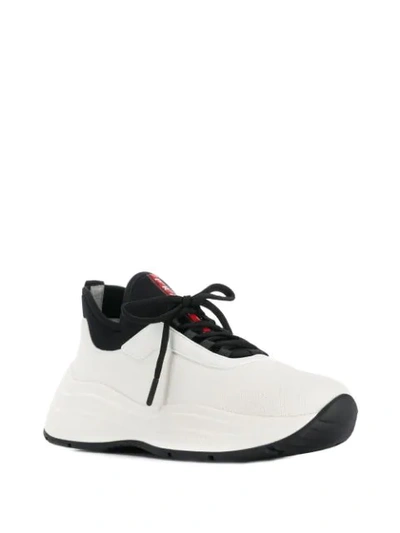 Shop Prada Lace-up Sneakers In White