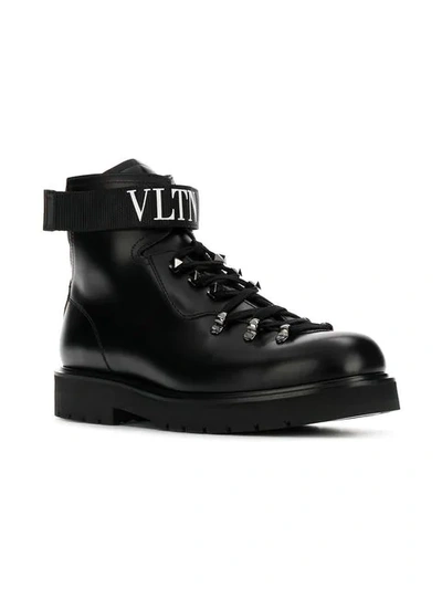 Shop Valentino Vltn Boots In Black