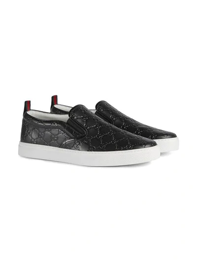 Shop Gucci Signature Slip-on Sneakers In Black