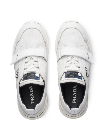 Shop Prada Crepe-effect Sneakers In White