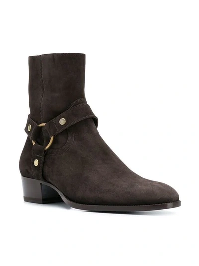 Shop Saint Laurent Wyatt Harness Boots In Brown