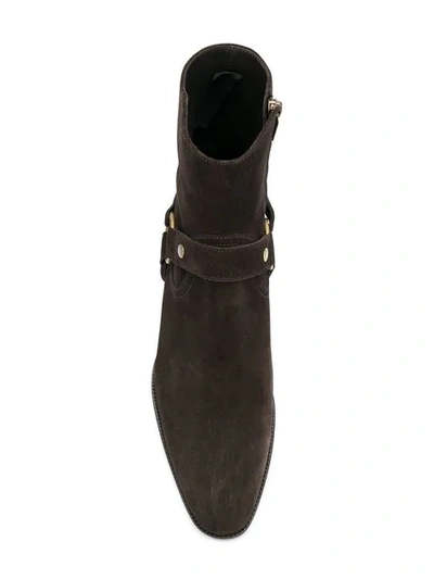 Shop Saint Laurent Wyatt Harness Boots In Brown