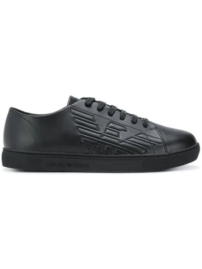 Shop Emporio Armani Embossed Logo Sneakers In 00002 Black