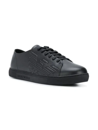 Shop Emporio Armani Embossed Logo Sneakers In 00002 Black