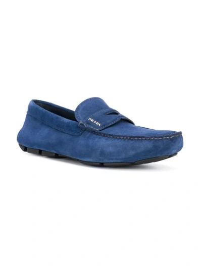 Shop Prada Logo Driving Loafers In Blue