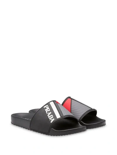 Shop Prada Logo Embossed Flat Slides - Black