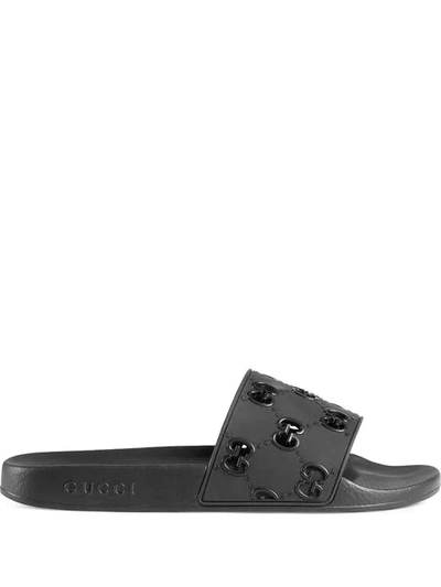 Shop Gucci Rubber Gg Slide Sandal In Black