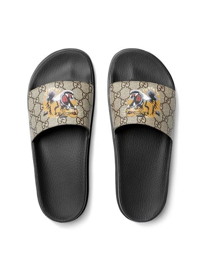 Shop Gucci Gg Supreme Tiger Slide Sandal In Brown