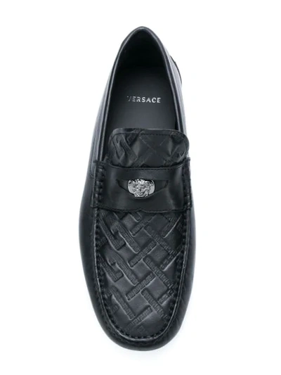 Shop Versace Grecca Embossed Loafers In Black