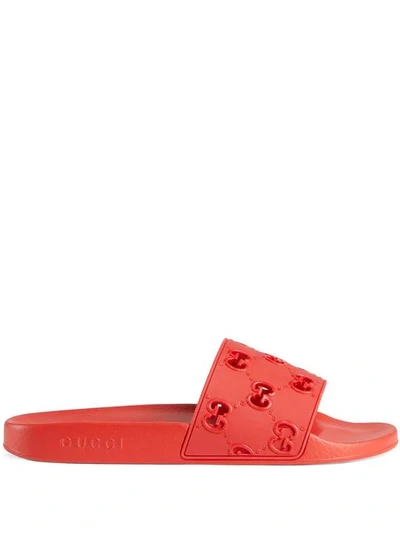 Shop Gucci Rubber Gg Slide Sandal In Red