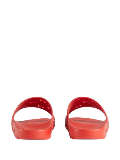 Shop Gucci Rubber Gg Slide Sandal In Red