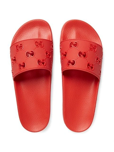 Shop Gucci Rubber Gg Slide Sandal In Red