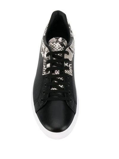 Shop Roberto Cavalli Embossed Detail Sneakers In Black