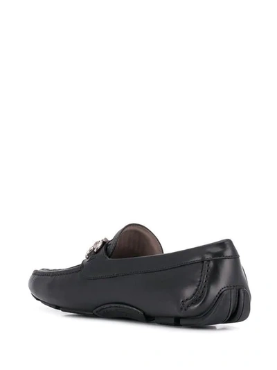 Shop Ferragamo Buckle Loafers In Black