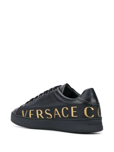 Shop Versace Logo Print Lace Up Sneakers In Black