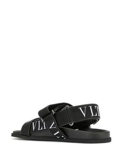 Shop Valentino Vltn Sandals In Black