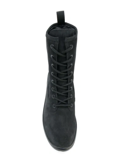 Shop Yeezy Combat Boots In Black