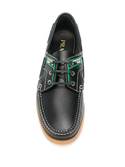 Shop Prada Logo Patch Loafers In Black