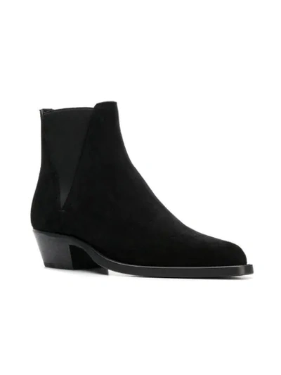 Shop Saint Laurent Dakota Chelsea Boots In Black