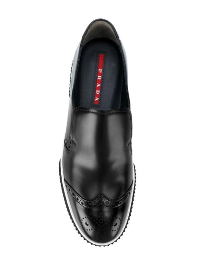Shop Prada Brogue Detail Loafers In Black