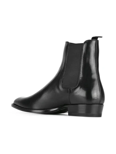 Shop Saint Laurent Wyatt Ankle Boots In Black