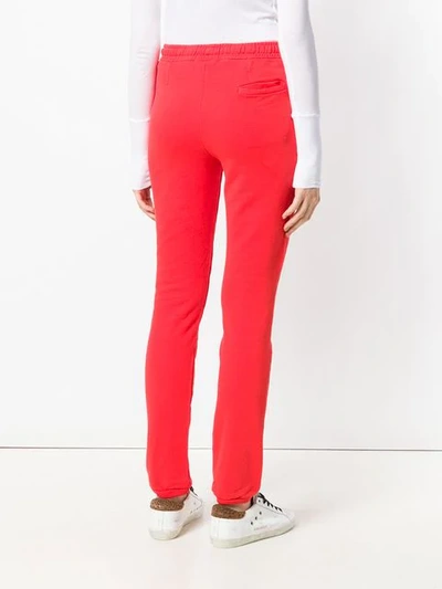 Shop Humanoid Track Trousers In Red