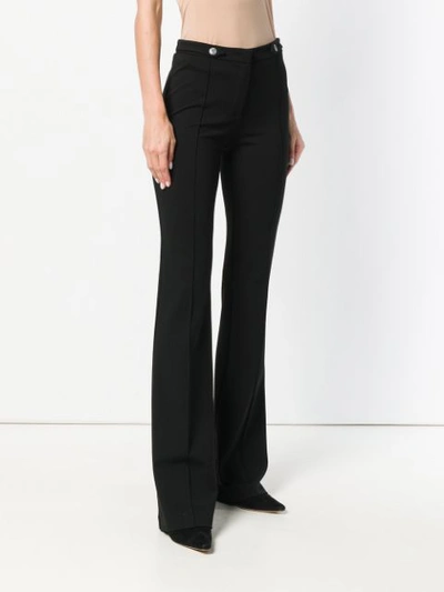 Shop Pinko Creased Flared Trousers In Black